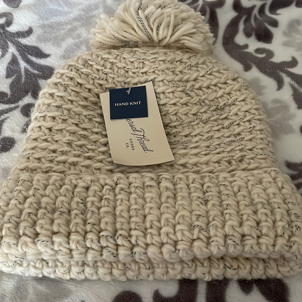 New with tags beanie in the color cream.